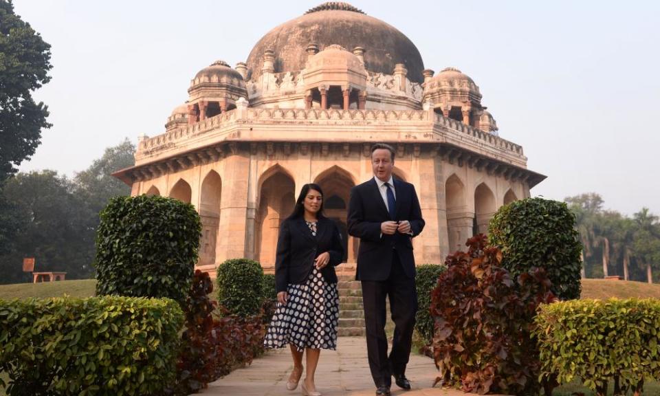 David Cameron and Priti Patel in front of the Shah Sayyid Tomb in the Lodi Gardens in Delhi, India.