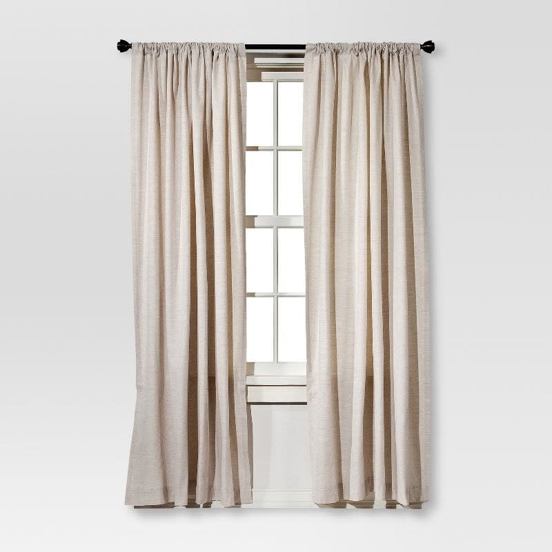 two of the curtain in cream on a window