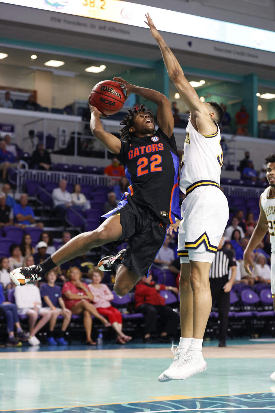 Florida guard Tyree Appleby (22) drives to the basket against California guard Jordan Shepherd (31) during the first half of an NCAA college basketball game Monday, Nov. 22, 2021, in Fort Myers, Fla. (AP Photo/Scott Audette)