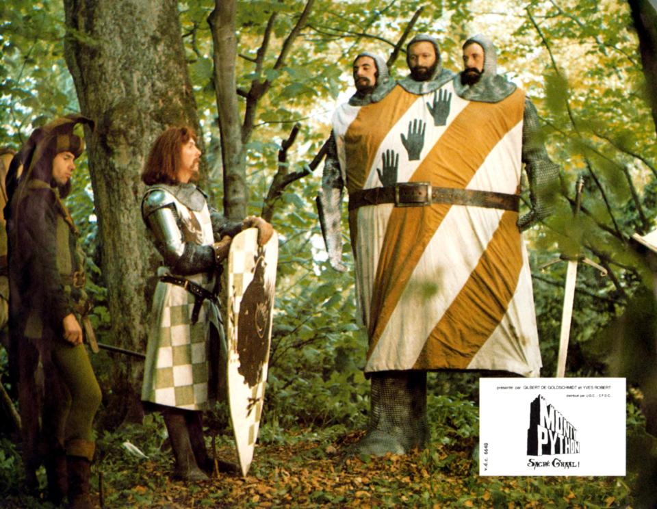 Monty Python And The Holy Grail, lobbycard, from left: Neil Innes, Eric Idle, three heads from left: Terry Jones, Graham Chapman, Michael Palin, 1975. (Photo by LMPC via Getty Images)