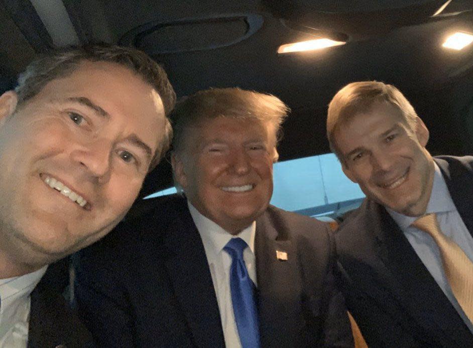 U.S. Rep. Michael Waltz, left, rides in a limo to a dinner in Miami on Dec. 7, 2019, with President Donald Trump and Rep. Jim Jordan of Ohio. Waltz announced his endorsement of Trump's 2024 campaign for president on Thursday.