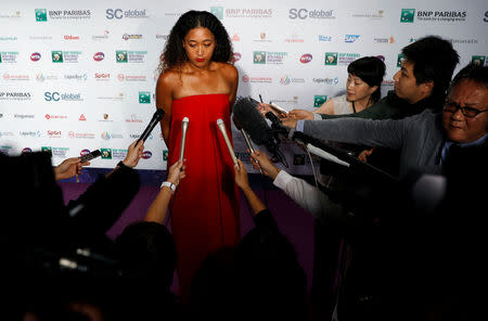 Naomi Osaka of Japan speaks to media after the singles draw ceremony of the WTA Tennis Finals in Singapore October 19, 2018. REUTERS/Edgar Su