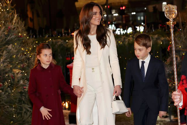 <p>Chris Jackson/Getty</p> Princess Charlotte, Kate Middleton and Prince George at the Christmas concert on Dec. 8, 2023