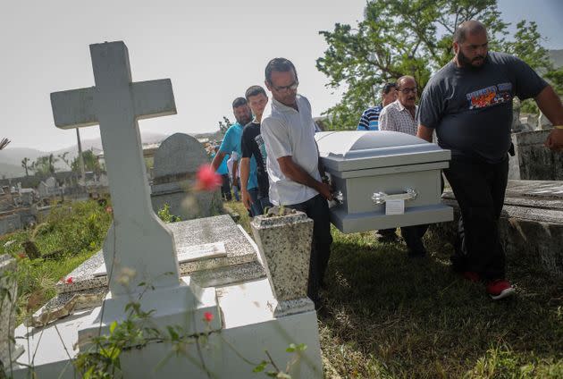 Mourners carry the casket of Wilfredo Torres Rivera, 58, who died Oct. 13, 2017, after jumping off a bridge three weeks after Hurricane Maria, in Utuado, Puerto Rico. (Photo: Mario Tama via Getty Images)