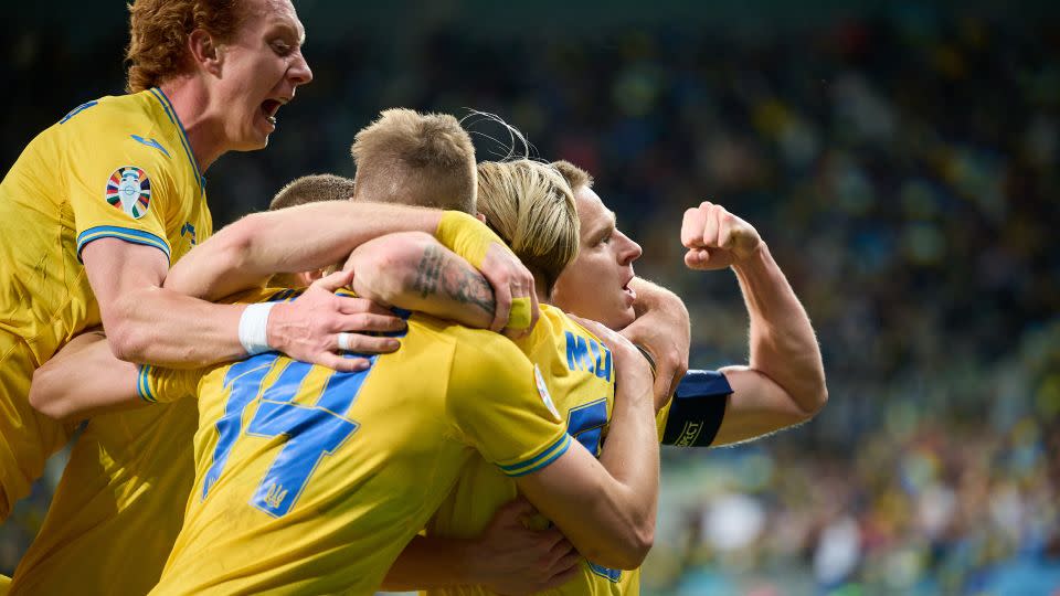 Ukraine players celebrate scoring their team's second goal during the playoff against Iceland. - Rafal Oleksiewicz/Getty Images