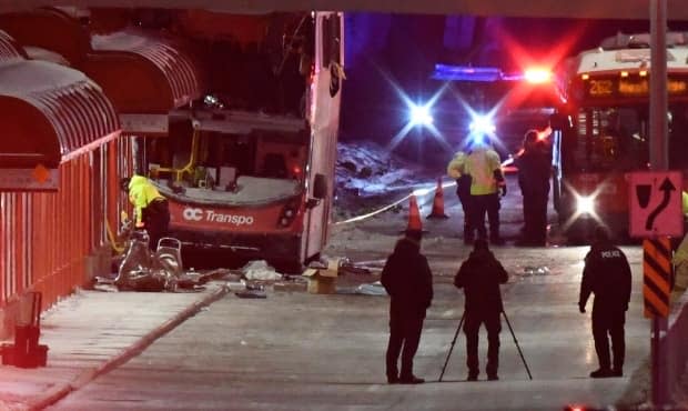 Police and first responders work at Westboro station where a double-decker OC Transpo bus struck the shelter on Jan. 11, 2019. The trial of the bus driver, who's pleaded not guilty to three counts of dangerous driving causing death and 35 counts of dangerous driving causing bodily harm, is expected to last eight weeks.  (Justin Tang/The Canadian Press - image credit)