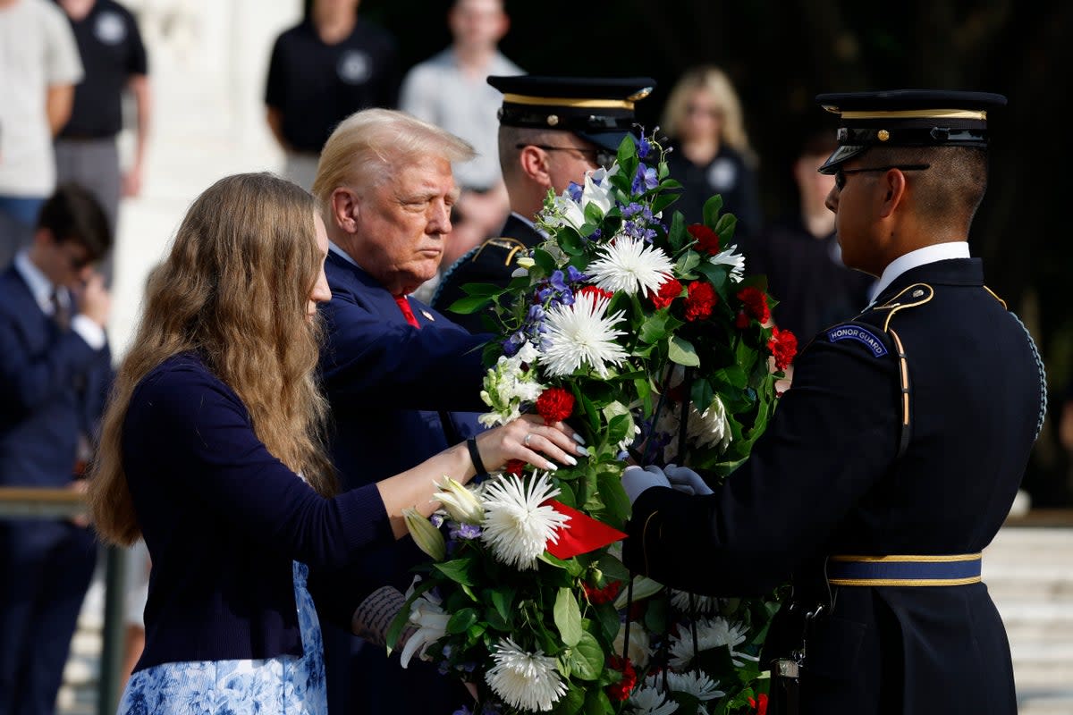 Donald Trump stands alongside Misty Fuoco, whose sister Sgt. Nicole Gee died in Abbey Gate Bombing, at a wreath-laying ceremony at the Tomb of the Unknown Soldier at Arlington National Cemetery on August 26 in Arlington, Virginia (Getty Images)