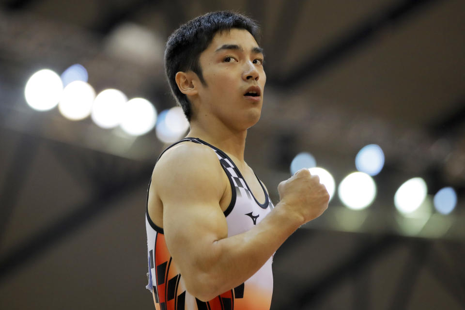 Japan's Kenzo Shirai clenches his fist after his performance on the pommel horse during the Men's All-Around Final of the Gymnastics World Chamionships at the Aspire Dome in Doha, Qatar, Wednesday, Oct. 31, 2018. (AP Photo/Vadim Ghirda)