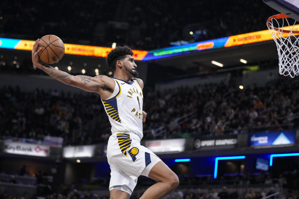 Indiana Pacers forward Obi Toppin (1) goes up for a dunk against the Los Angeles Clippers during the first half of an NBA basketball game in Indianapolis, Monday, Dec. 18, 2023. (AP Photo/Michael Conroy)