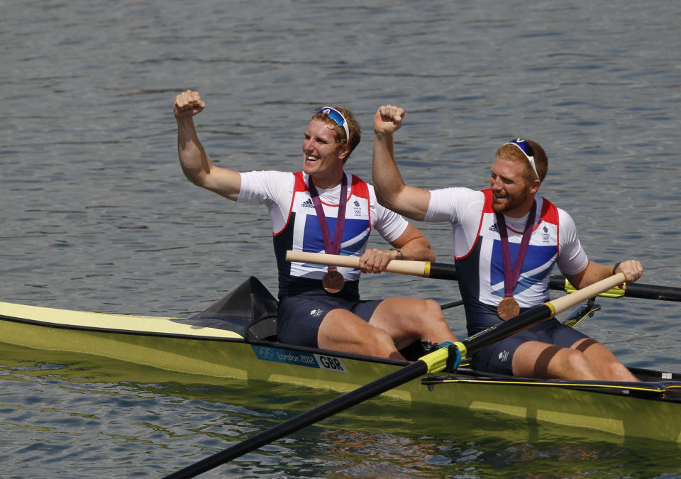 Bronze medallists George Nash and William Satch (R) of Britain pose after the medals ceremony for the Men's Pair Final event during the London 2012 Olympic Games at Eton Dorney August 3, 2012. REUTERS/Mark Blinch (BRITAIN - Tags: OLYMPICS SPORT ROWING) 