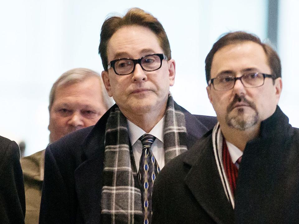 H. Ty Warner, center, the billionaire who created Beanie Babies, leaves federal court after being sentenced on Tuesday, Jan. 14, 2014, in Chicago. Warner was sentenced to two years of probation, but no prison time, for tax evasion on $25 million in income he had stashed away in Swiss bank accounts.
