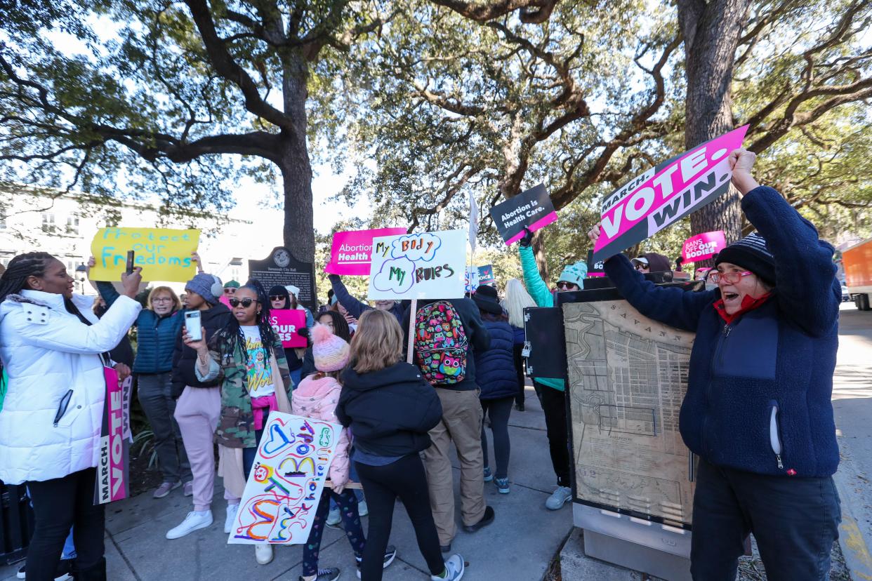 Abortion-rights supporters wave signs and chant near Savannah City Hall during the "Bigger Than Roe" rally and march on Saturday, January 20, 2024.