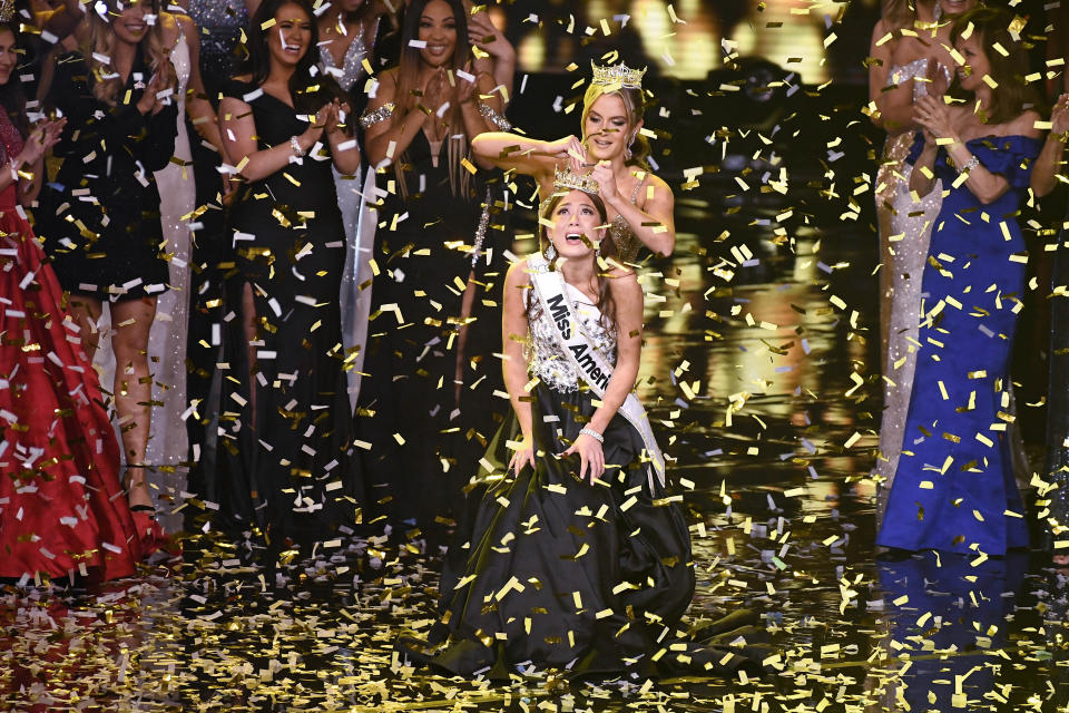 Miss Alaska Emma Broyles reacts as she is crowned by 2020 Miss America Camille Schrier, after winning the Miss America competition, Thursday, Dec. 16, 2021, at Mohegan Sun in Uncasville, Conn. (AP Photo/Jessica Hill)