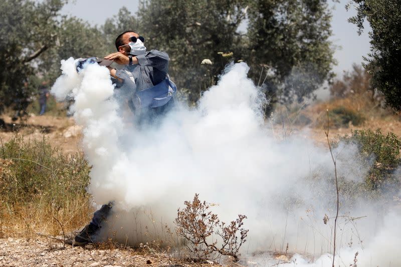 Palestinians protest against Israeli settlements, in West Bank