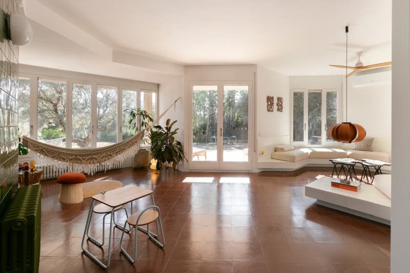 Terra cotta tiled flooring in sunny living area.