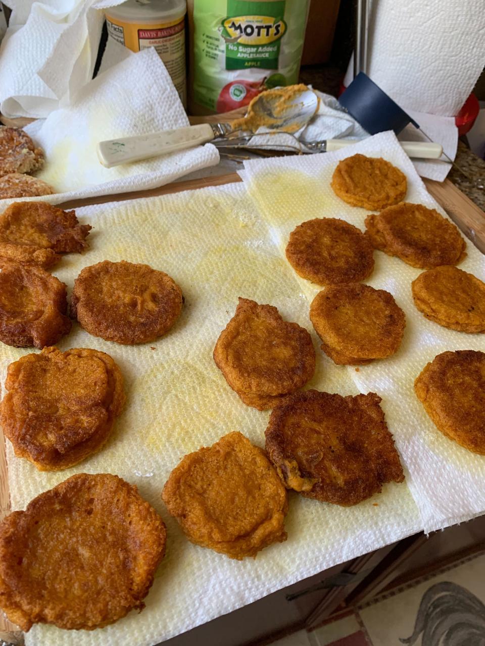 a paper towel covered with fresh pumpkin fritters