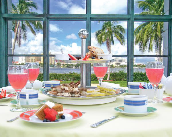 <p>Courtesy of The Palm Beaches PR</p> Tea at the Flagler Museum with a view of the yachts outside