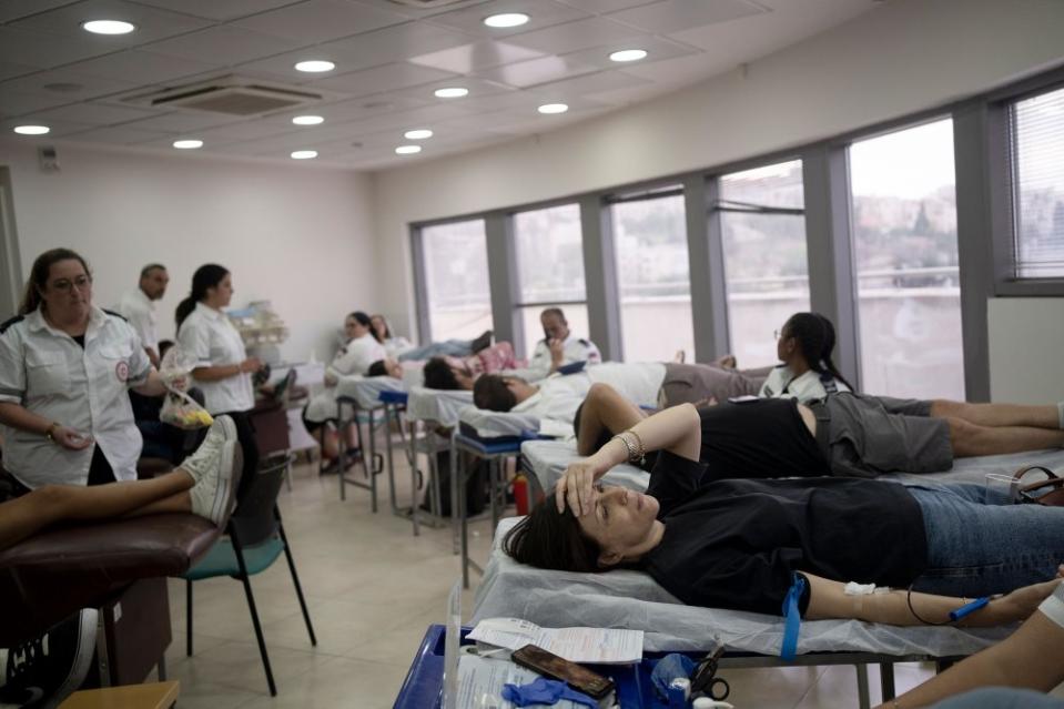 Israelis donate blood at Magen David Adom emergency service in Jerusalem, following an unprecedented attack by Hamas militants on Israel, on Oct. 7.<span class="copyright">Maya Alleruzzo—AP</span>