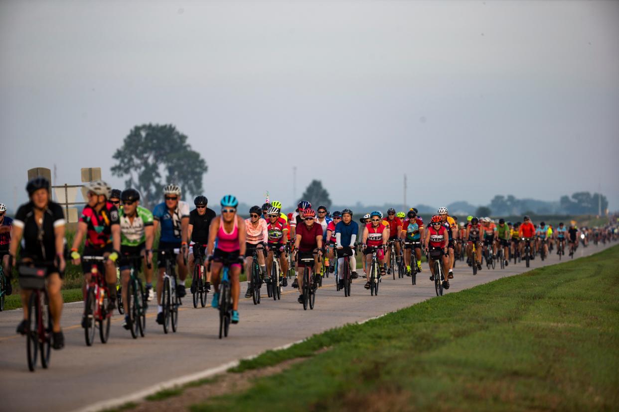 Cyclists make their way along the route to Ida Grove during the first day of RAGBRAI in 2022.