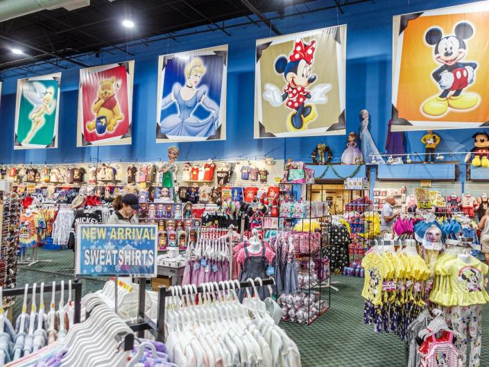 A Bargain World Gift Shop, where customers can buy Disney character souvenirs.