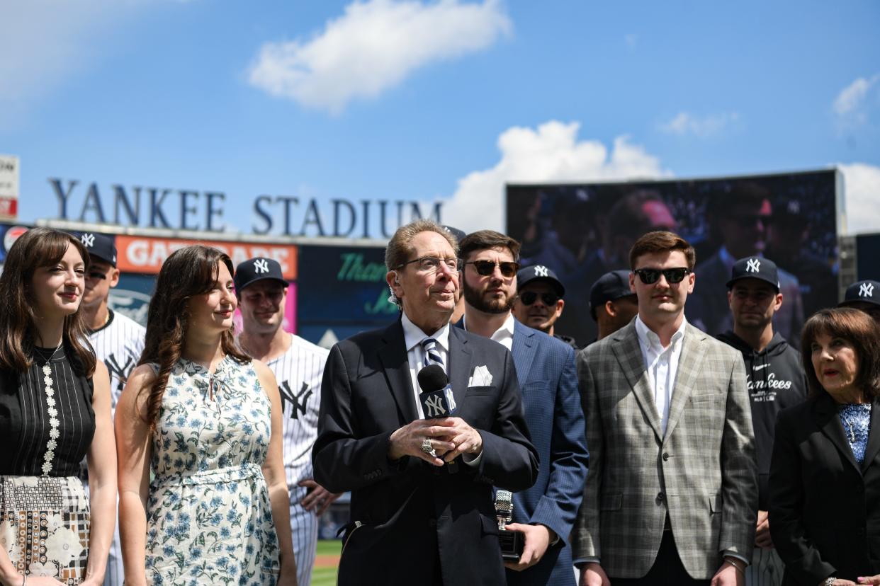 Apr 20, 2024; Bronx, New York, USA; Longtime Yankee announcer John Sterling is honored during a pregame ceremony in recognition of his retirement before a game against the Toronto Blue Jays at Yankee Stadium.