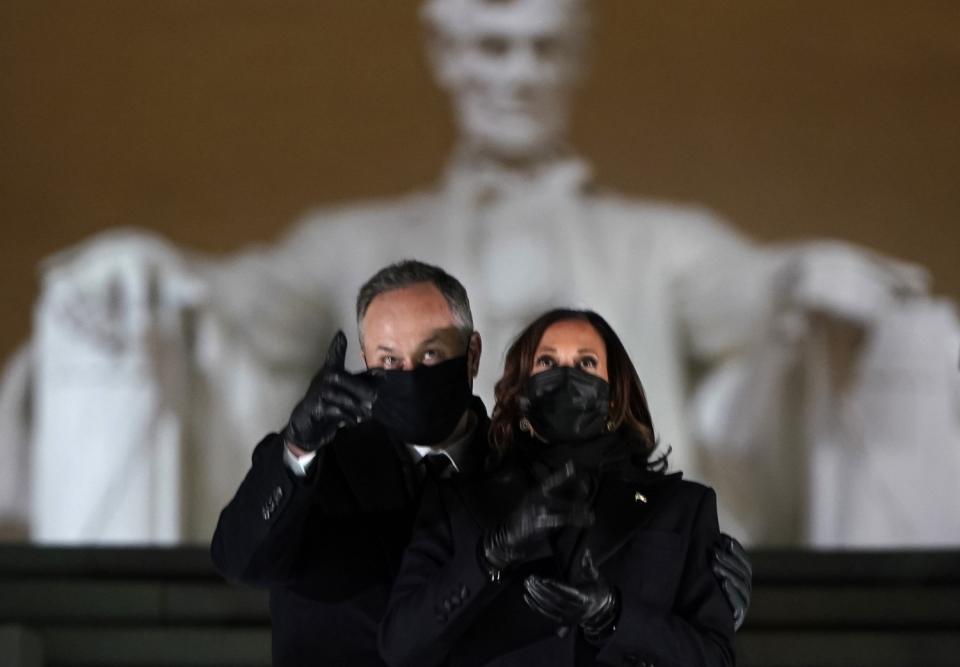 Vice President Kamala Harris and her husband Doug Emhoff watch fireworks at the Celebrating America concert.