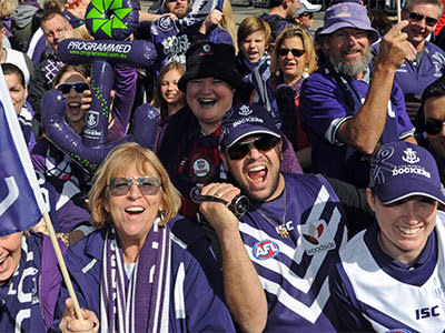 Fremantle Dockers supporters gather for the AFL Grand Final parade Collins Street in Melbourne, Friday, Sept. 27, 2013. Photo: AAP