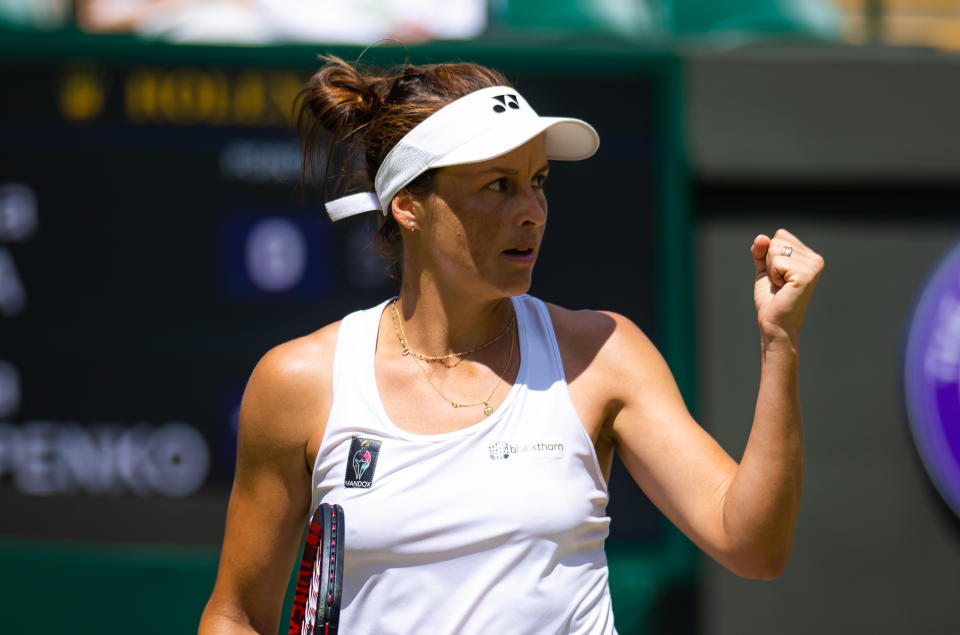 Tatjana Maria (pictured) fist-pumps in celebration at Wimbledon.