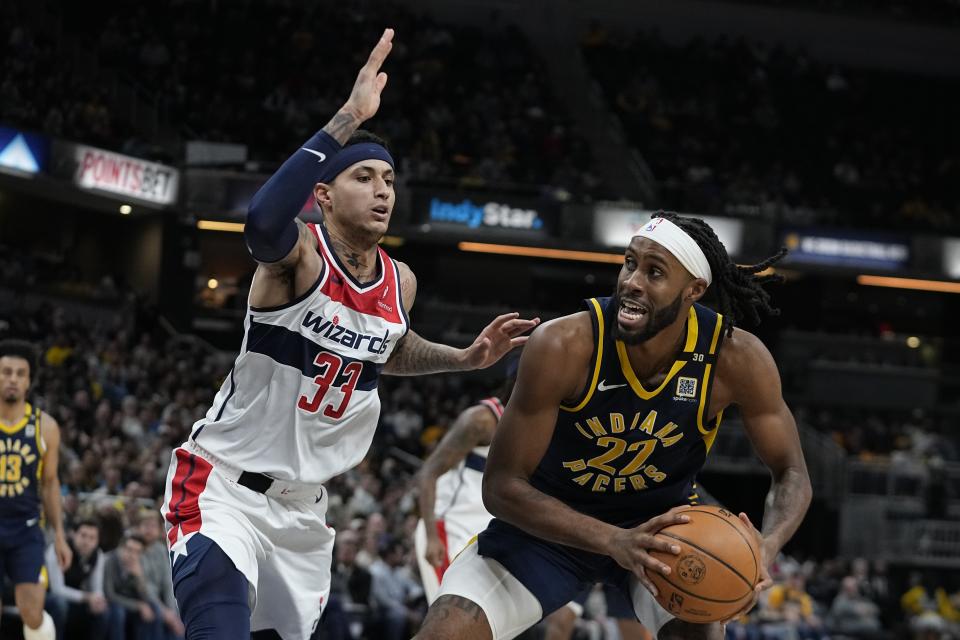 Indiana Pacers' Isaiah Jackson (22) is defended by Washington Wizards' Kyle Kuzma (33) during the first half of an NBA basketball game Wednesday, Jan. 10, 2024, in Indianapolis. (AP Photo/Darron Cummings)