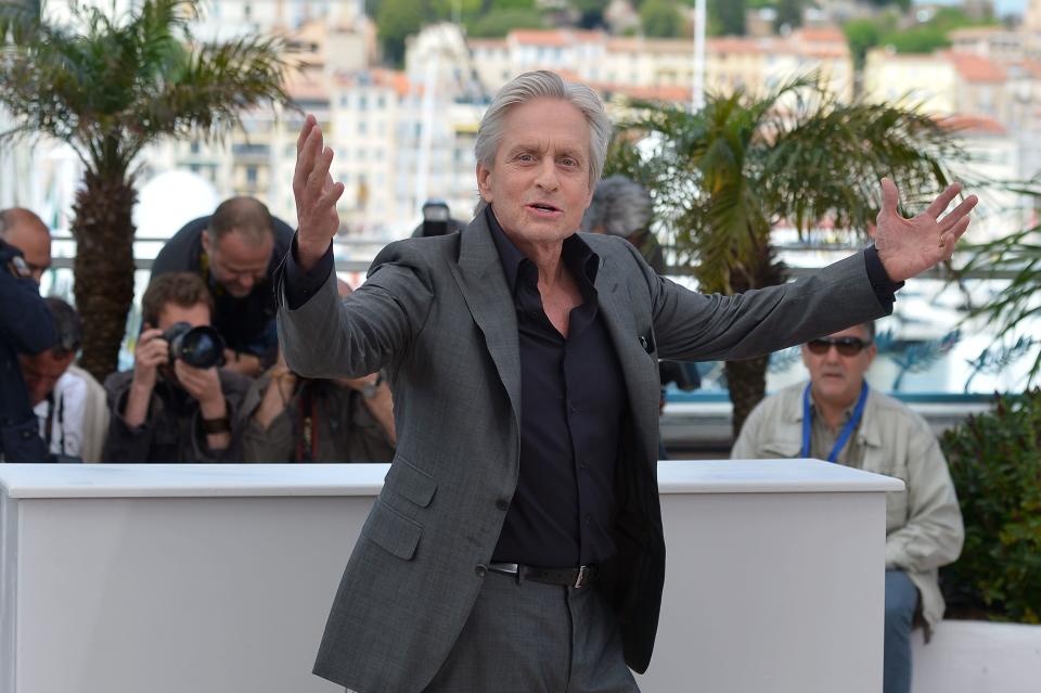 US actor Michael Douglas poses on May 21, 2013 during a photocall for the film "Behind the Candelabra" presented in Competition at the 66th edition of the Cannes Film Festival in Cannes. Cannes, one of the world's top film festivals, opened on May 15 and will climax on May 26 with awards selected by a jury headed this year by Hollywood legend Steven Spielberg.      AFP PHOTO / ALBERTO PIZZOLI        (Photo credit should read ALBERTO PIZZOLI/AFP/Getty Images)