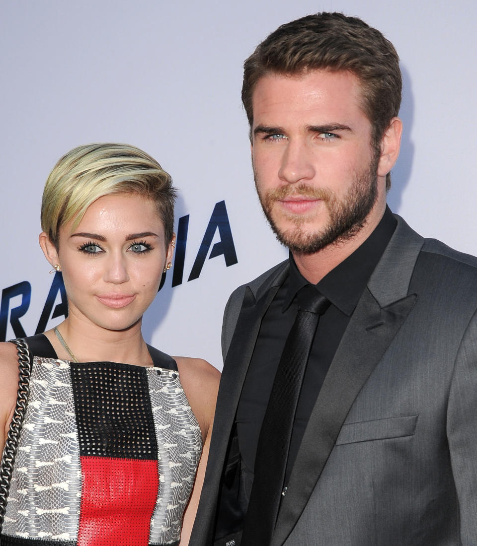 LOS ANGELES, CA - AUGUST 08:  MIley Cyrus and Liam Hemsworth arrives at the &quot;Paranoia&quot; - Los Angeles Premiere at DGA Theater on August 8, 2013 in Los Angeles, California.  (Photo by Steve Granitz/WireImage)