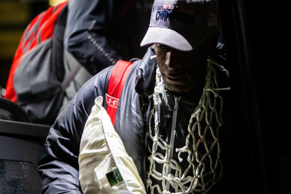 Boston University coach Joe Jones steps off the bus after the Terriers won the Patriot League title. (Photo credit: BU Athletics)