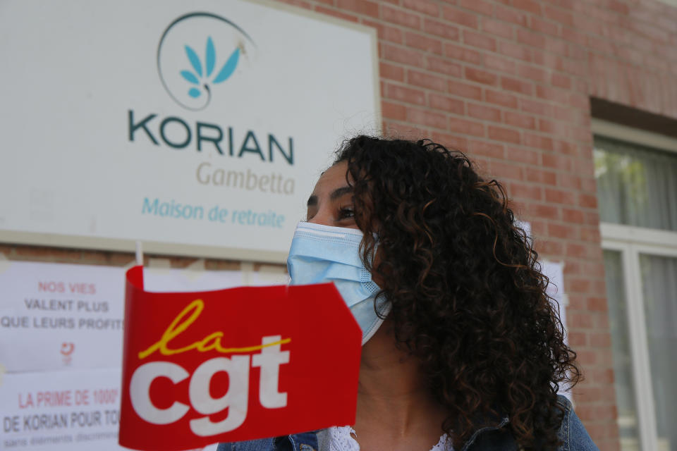 Employees demonstrate outside a nursing home of the Korian group, one of the market leaders in the lucrative industry of providing care and assisted living facilities for older adults, Monday, May 25, 2020 in Lille, northern France. In France, the group is facing several lawsuits filed by families who have lost loved ones during the coronavirus pandemic that has caused thousands of deaths in French care homes. (AP Photo/Michel Spingler)