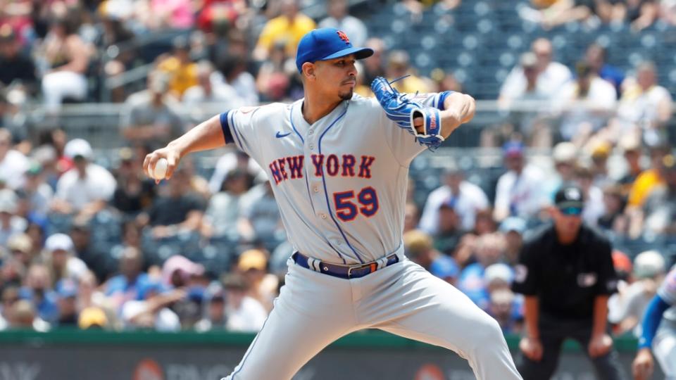 June 11, 2023;  Pittsburgh, Pennsylvania, USA;  New York Mets starting pitcher Carlos Carrasco (59) delivers a pitch against the Pittsburgh Pirates during the first inning at PNC Park.  Mandatory Credit: Charles LeClaire-USA TODAY Sports