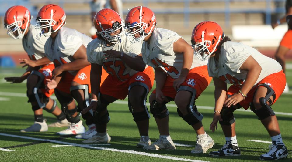 San Angelo Central High School's offensive linemen work on getting in sync during the first preseason practice at San Angelo Stadium on Monday, Aug. 8, 2022.