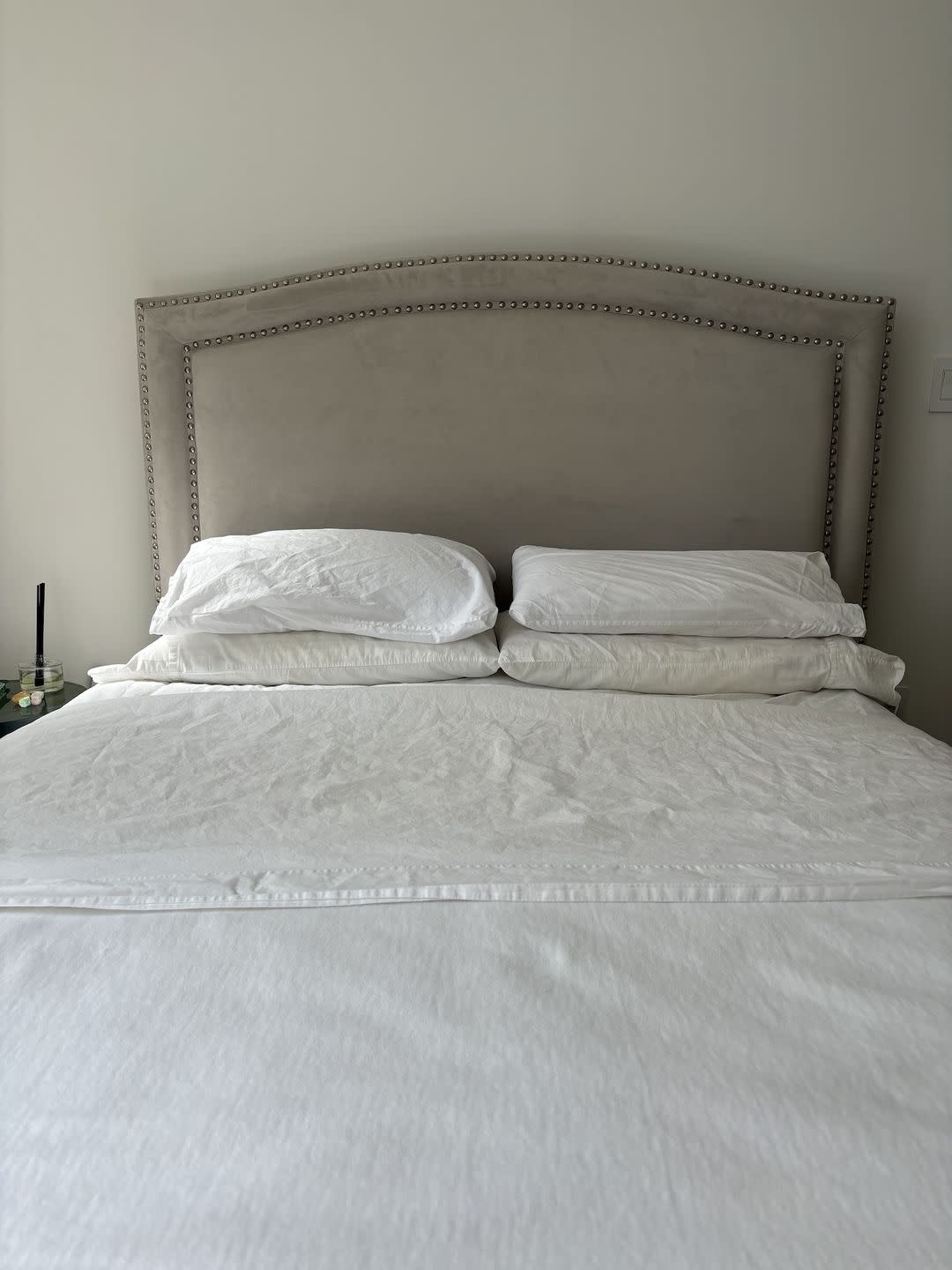 a bed with white sheets