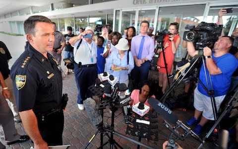 Jacksonville Sheriff Mike Williams addresses the media across the street from the scene of a multiple shooting at The Jacksonville Landing - Credit: AP