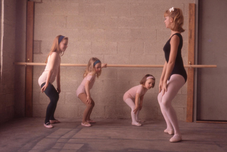 American dancer and dance instructor, and future actress, Goldie Hawn demonstrates a position for her young ballet students, Washington DC, 1964.