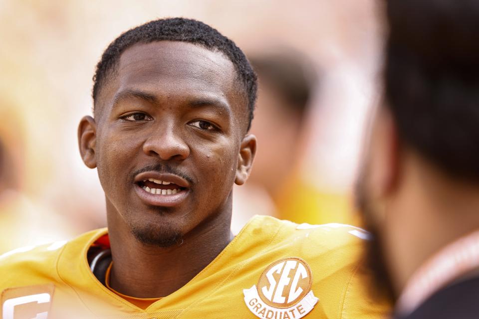 Tennessee quarterback Hendon Hooker (5) takes a break on the sideline during the second half of an NCAA college football game against Tennessee Martin, Saturday, Oct. 22, 2022, in Knoxville, Tenn. Tennessee won 65-24. (AP Photo/Wade Payne)