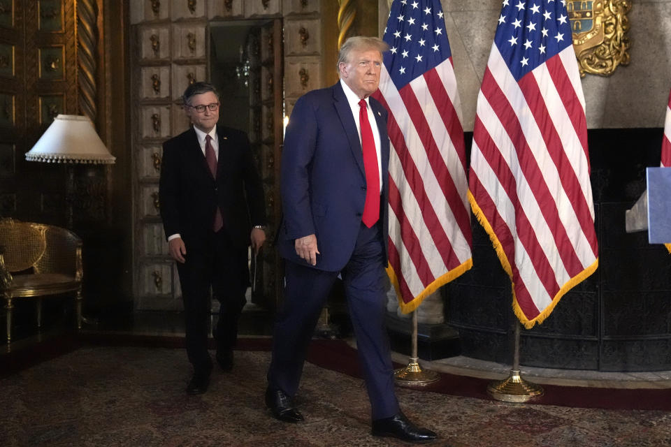 Republican presidential candidate former President Donald Trump, right, and Speaker of the House Mike Johnson, R-La., arrive at a news conference, Friday, April 12, 2024, at Mar-a-Lago in Palm Beach, Fla. (AP Photo/Wilfredo Lee)