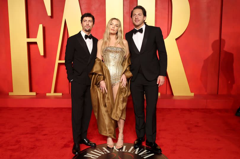BEVERLY HILLS, CALIFORNIA - MARCH 10: (L-R) Josey McNamara, Margot Robbie and Tom Ackerley attend the 2024 Vanity Fair Oscar Party Hosted By Radhika Jones at Wallis Annenberg Center for the Performing Arts on March 10, 2024 in Beverly Hills, California. (Photo by Amy Sussman/Getty Images)