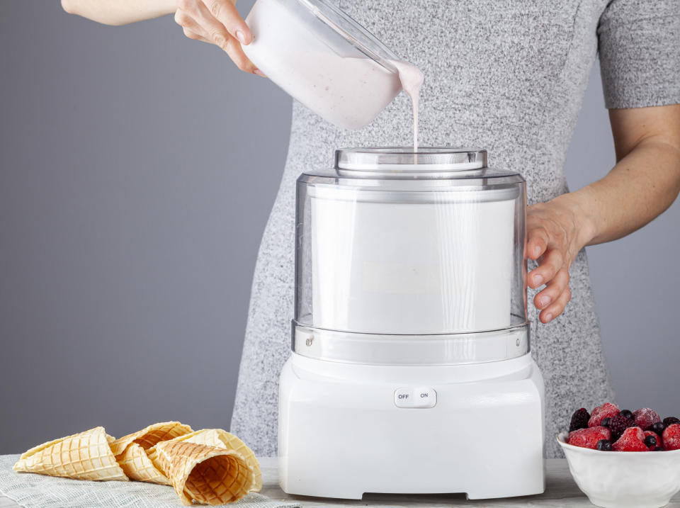 A person using an ice cream maker