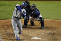 Los Angeles Dodgers' Corey Seager hits a RBI-single against the Tampa Bay Rays during the eighth inning in Game 4 of the baseball World Series Saturday, Oct. 24, 2020, in Arlington, Texas. (AP Photo/Sue Ogrocki)