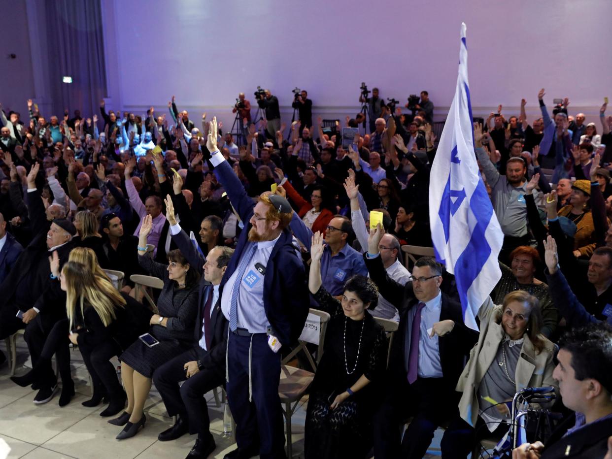 Likud party members vote during a Likud Central Committee meeting in Airport City, Israel December 31, 2017: REUTERS/Amir Cohen