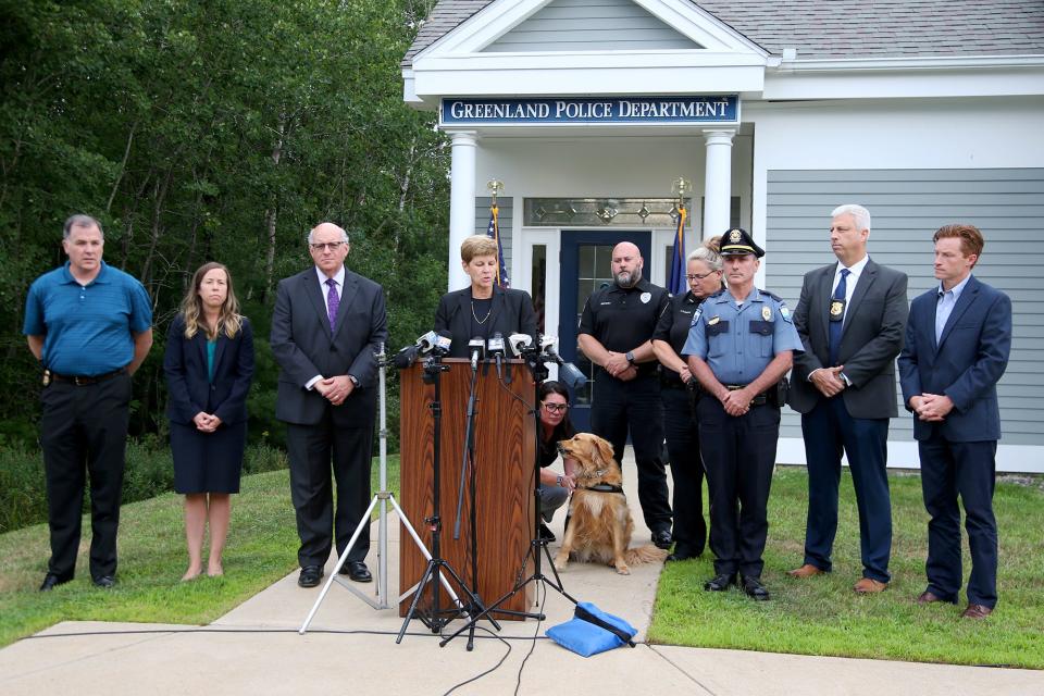 Jane Young, U.S. attorney for New Hampshire, is flanked by law enforcement officials as she holds a press conference at the Greenland Police Department Tuesday, Aug. 9, 2022 to share information regarding the arrest of First Student bus driver Michael Chick of Eliot, Maine, on an interstate stalking charge.