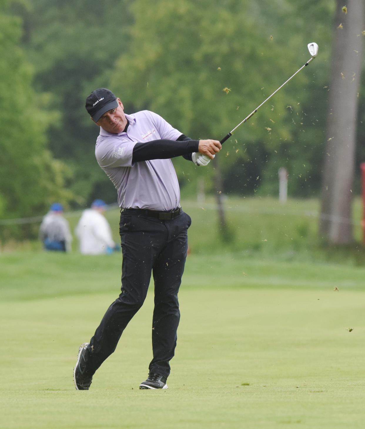 Scott McCarron hits from the fairway on the 16th hole during the second round of the Senior PGA Championship golf tournament, Friday, May 27, 2022, at Harbor Shores in Benton Harbor, Mich.(Don Campbell/The Herald-Palladium via AP)