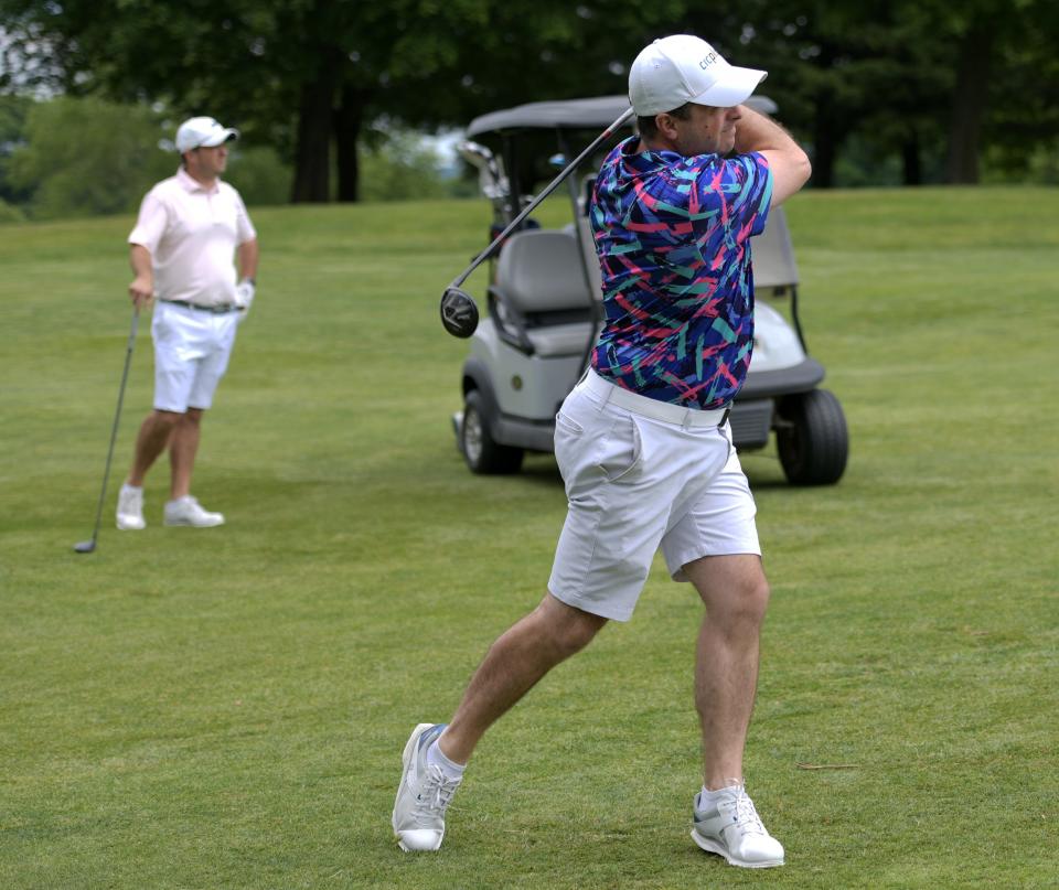 Dave Falcucci hits from the fairway during the Walter Cosgrove Four Ball tournament at Green Hill Municipal Golf Course on Sunday.