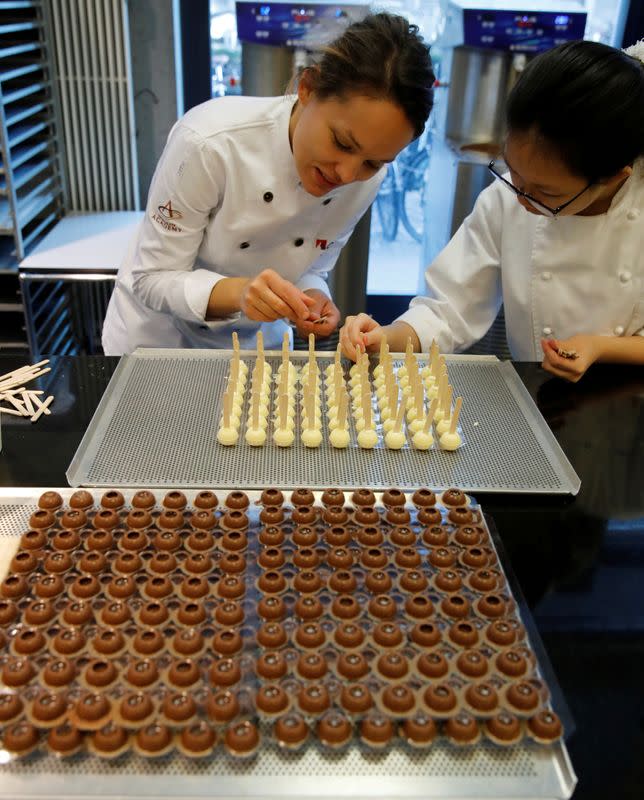 FILE PHOTO: Empoyees of chocolate and cocoa product maker Barry Callebaut prepare chocolates in Zurich