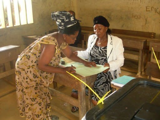 Retired secretary Delphine Alene-Ondo prepares to vote in a school at Medouneu, northern Gabon. Voters trickled to the polls in Gabon Saturday in legislative elections expected to hand a thumping victory to President Ali Bongo's party in the face of a boycott by some opposition groups