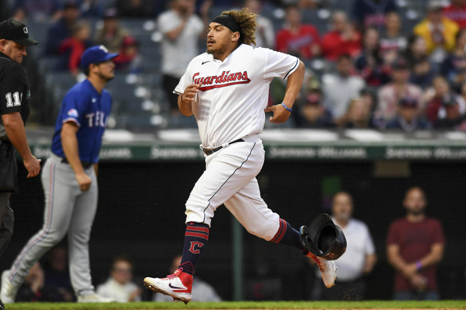 Cleveland Guardians' Josh Naylor scores on a double by Andrés Giménez against the Texas Rangers during the second inning of a baseball game Wednesday, June 8, 2022, in Cleveland. (AP Photo/Nick Cammett)